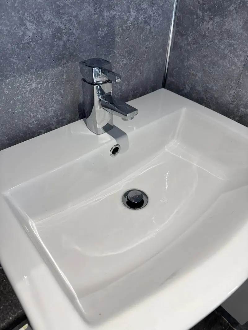 Gleaming clean sink after limescale removal