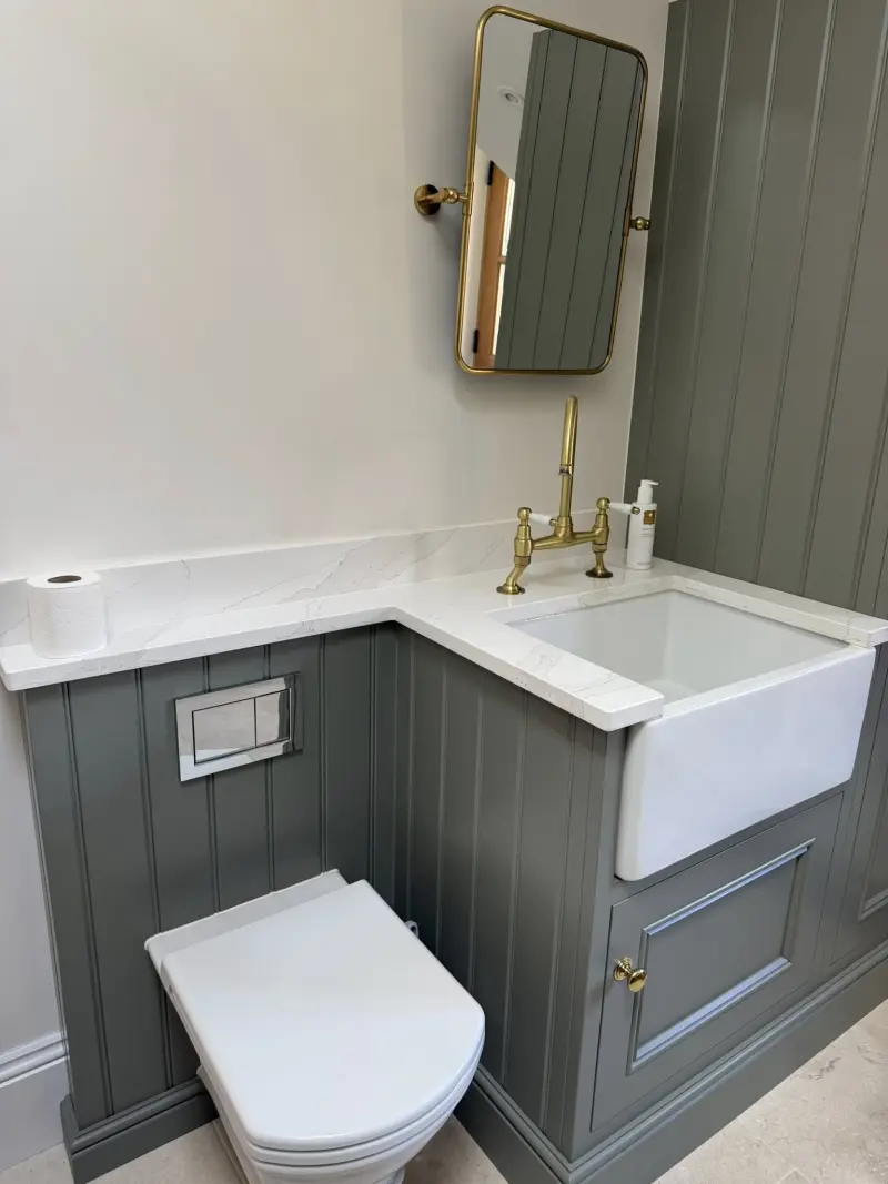 Green-panelled bathroom cleaned to a high standard
