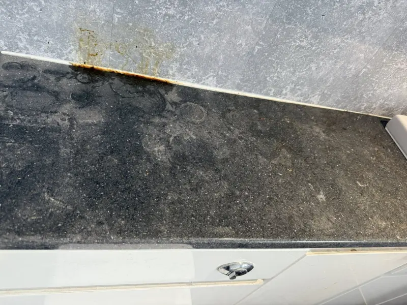 Grimy kitchen counter before cleaning