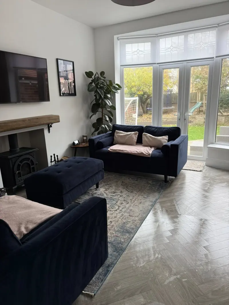 Clean living room with polished floors — residential cleaning service
